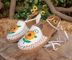 Womens sunflower embroidered leather closed toe lace up flat mexican sandals -color white Chanclas Mexican, Summer Huarache Sandals With Rubber Sole, Casual Embroidered Huarache Sandals For Spring, Spring Vacation Huaraches With Rubber Sole, Summer Adjustable Huaraches With Rubber Sole, Adjustable Summer Huaraches With Rubber Sole, Adjustable Rubber Sole Huaraches For Summer, Spring Festival Huarache Sandals With Round Toe, Traditional Summer Huaraches With Adjustable Fit