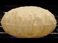 a ball of dough sitting on top of an oven rack