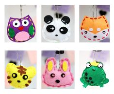 four different animal shaped ornaments hanging from chains with eyes and ears on each ornament