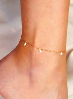 Design your own Gold Star Anklet! The chain is dainty and glistening, making it the perfect anklet for a special occasion as well as everyday wear. Model is wearing a 14k gold filled adjustable anklet with 5 star charms, you can also purchase the necklace, earrings, and/or bracelet version to match. You request only 1 star on the anklets or necklace and up to 5 stars total. *All bracelets are adjustable to fit multiple ankle widths. For a specific anklet length just leave your request in the per Star Charm Anklets Suitable As A Gift, Star Charm Anklets For Gifts, Star Charm Anklets As Gift, Dainty Stars, Blush Jewelry, Dainty Anklet, Star Anklet, Anklet Gold, Charm Anklet