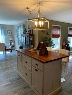 a kitchen island in the middle of a living room