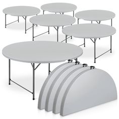 six round tables with white plastic tops on each side and four smaller ones in the middle