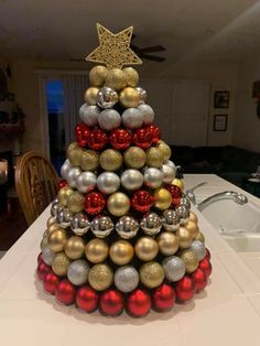 a christmas tree made out of balls and ornaments