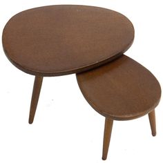 two wooden tables sitting on top of each other