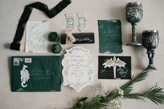 the wedding stationery is laid out on the table