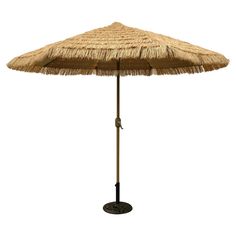 an umbrella that is made out of straw