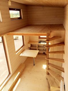 the inside of a tiny house with stairs