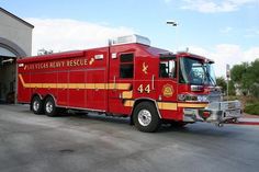 a red fire truck parked in front of a building