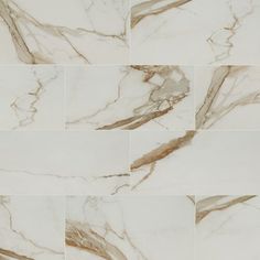 white marble tiles with brown streaks on them