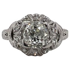 Original Art Deco diamond engagement ring handcrafted in platinum. The ring features an approximately 1.35 carat Old European cut diamond, and 20 surrounding diamonds weighing another .20 carats. The diamonds are graded G color and SI-I1 clarity. The top of the ring measures 11 x 11mm and is currently size 6.5 (can be sized). Estate Engagement Ring, Art Deco Diamond Ring Engagement, Vintage Wedding Jewelry, Vintage Art Deco Rings, Antique Engagement Rings Vintage, Antique Jewelry Rings, Platinum Engagement Ring, Platinum Diamond Engagement Rings, Art Deco Diamond Rings