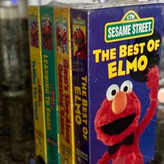 sesame street the best of elmo series books on a counter with other children's books