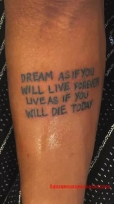 a person with a tattoo saying dream as if you will live forever