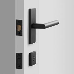 an open door with black handles and knobs on the outside wall, in front of a white background