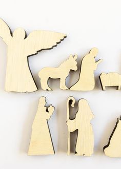 wooden cutouts of nativity and christmas decorations