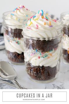 cupcakes in a jar with white frosting and sprinkles