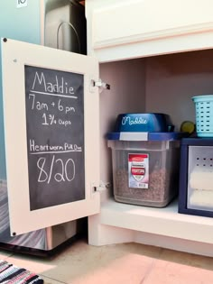 the kitchen cabinet message board is posted on the wall