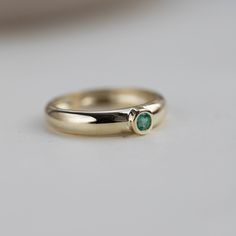 Chunky Emerald Ring 14K Gold - Dome Natural Gemstone Ring Solid Gold Wide - Anniversary Gift D E T A I L S ● Metal: 14K solid gold, 14K white gold ● Gemstone: Natural Emerald 3mm ● Emerald's Weight: 0.12ct R I N G ∙ S I Z I N G For General Reference: ● we use standard US Ring Sizing ● an average women's ring finger is size 6-7 ● each ring is custom-made upon order, in any desired size. ● if your ring size is not listed please contact us H O W ∙ T O ∙ O R D E R Choose from the drop-down menus the Polished Emerald Ring For Wedding, Fine Jewelry Emerald Ring With Tension Setting, Yellow Gold Emerald Ring With Tension Setting As Gift, Emerald Bezel Setting Ring For Promise, Promise Emerald Ring In Yellow Gold, Anniversary Emerald Ring With Tension Setting In Yellow Gold, Yellow Gold Emerald Ring With Tension Setting For Anniversary, Formal Emerald Ring With Tension Setting For May Birthstone, Anniversary Yellow Gold Emerald Ring With Tension Setting