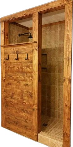 an open wooden door leading to a walk in shower