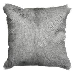 a black and white photo of a pillow with grey fur on it's back