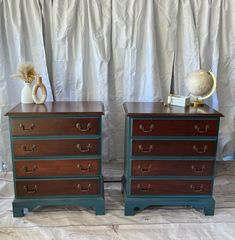 two wooden dressers sitting next to each other