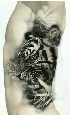 a black and white photo of a tiger on the arm