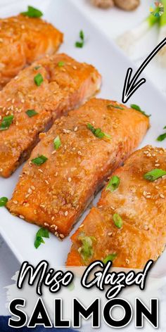 salmon fillets on a white plate with sesame seeds