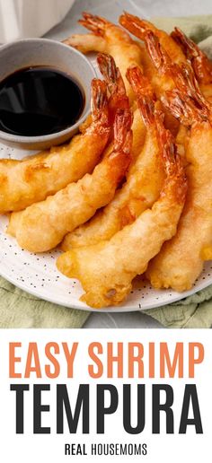 some shrimp is on a white plate with dipping sauce and the words easy shrimp tempura