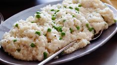 a plate with rice and peas on it