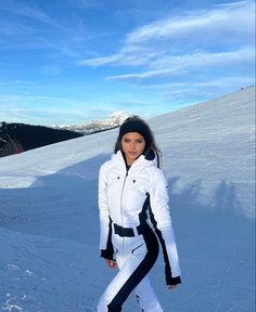 a woman standing on skis in the snow