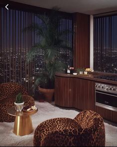 a living room filled with lots of furniture and a window covered in blinds next to a stove top oven