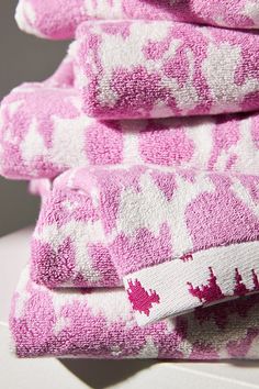 pink and white towels stacked on top of each other in the shape of deers