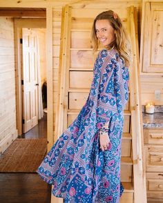 The Audrey Printed Maxi Dress in Blue is a truly unique and mesmerizing piece. The color combination is enchanting and will surely make you stand out in any crowd. Made from 100% Indian cotton, this dress is not only beautiful but also comfortable to wear. Whether you pair it with ankle boots or high heels, it will add a touch of glamour to your evening. This dress is a certified stunner and will quickly become a favorite in your collection. It comes in one size that fits sizes 2 to 12, making i Blue Long Bohemian Dress, Blue Maxi Dress For Festival, Blue Bohemian Maxi Dress, Blue Long Boho Dress For Summer, Blue Long Sleeve Boho Dress For Summer, Spring Bohemian Royal Blue Dress, Flowy Blue Midi Dress, Blue Long Sleeve Midi Dress For Vacation, Bohemian Royal Blue Maxi Dress