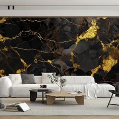 a living room with black and gold marble wallpaper, white couches and coffee table