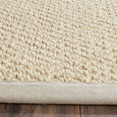 the textured area rug is made from natural wool