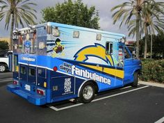 an ice cream truck is parked in a parking lot with palm trees and other vehicles