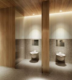 an empty bathroom with two urinals and one toilet in the middle, surrounded by wooden columns