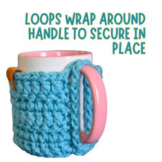 a blue crocheted coffee cup with a pink handle and the words loops wrap around handle to secure in place