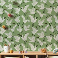 a green wallpaper with white birds flying in the sky and on it's sides