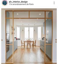 an open kitchen and dining room with sliding glass doors