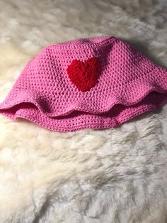 Fun Pink Crochet Hat For Beach, Trendy Pink Crochet Hat For Vacation, Red One Size Crochet Bucket Hat, Pink Crochet Hat, Fun Style, Playful Pink Hand-knitted Crochet Hat, Playful Pink Brimmed Crochet Hat, Handmade Pink Cotton Yarn Hat, Red Crochet Hat For Beach, Red Crochet Beanie For Beach