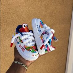 These Seasame Cartoon Custom Air Force 1 Shoes Are A Unique And Creative Addition To Your Footwear Collection. Their Custom Design Features Sesame Street Characters That Add A Playful Touch, While The Air Force 1 Style Provides Superior Comfort And Quality. Elevate Your Style With These One-Of-A-Kind Shoes. - Brand New With Box-Hand-Painted With Angelus Leather Paints- Worldwide Shipment. - All Customs Are Waterproof Scratch Resistant.- Simply Select Your Correct Size Son First Birthday, Custom Baby Shoes, Boys First Birthday Party, Mommy And Baby Pictures, Air Force 1 Shoes, Boys First Birthday Party Ideas, Baby Girl Ideas, Basket Diy, Boys First Birthday