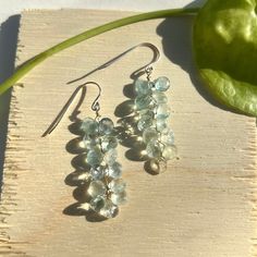 These beautiful dangle/drop earwire earrings are handmade/hand-wired, and are made with 100% NATURAL & AUTHENTIC Aquamarine Briolettes and Sterling Silver. The gemstones are naturally blue, white, and clear colored (they're from the earth, never artificially dyed. About Aquamarine: Aquamarine is a pale-blue to light-green variety of beryl. The color of aquamarine can be changed by heat. Aquamarine has a chemical composition of Be₃Al₂Si₆O₁₈, also containing Fe²⁺. It has a hardness of 7.5 to 8. Aquamarine is rarer in nature, especially in fine color. Its long history as a gem also adds to its collectibility. Aquamarine is the March birthstone. These earrings make the perfect unique gift for anyone in your life who appreciates beautiful, handcrafted jewelry with stunning authentic aquamarine Aquamarine Gem, Blue Sparkle, Blue Sparkles, Aqua Turquoise, Aquamarine Gemstone, Sparkling Crystal, March Birth Stone, Pricing Jewelry, Turquoise Blue