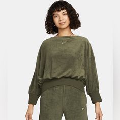 Women’s Size Xs Oversized Nwt Sold Out Color Color:Cargo Khaki/Oil Green Dropped Shoulders And Oversized Fit Provide Comfortable, Cozy Feel. Elongated Ribbing At Cuffs And Hem Provides Extra Comfort And Structure. Body: 41% Cotton/39% Rayon/20% Polyester. Rib: 49% Rayon/47% Cotton/4% Spandex. Embroidered Swoosh Logo Cropped Length Machine Wash Oversized Green Sports Top, Nike Workout Tops For Winter, Nike Winter Workout Tops, Winter Workout Nike Tops, Nike Tops For Fall Loungewear, Green Sportswear Sweatshirt For Workout, Green Sporty Sweatshirt For Workout, Green Workout Tops For Winter, Nike Athleisure Tops With Ribbed Cuffs