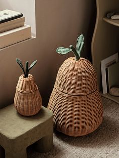 two wicker baskets sitting next to each other