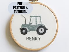 an embroidery pattern with a tractor and the words henry written in black ink on it