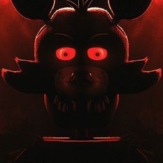 a creepy looking animal with red eyes and big ears on it's head in the dark