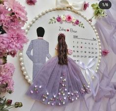 a cross stitch pattern with a man and woman in wedding dress on the cover of a calendar