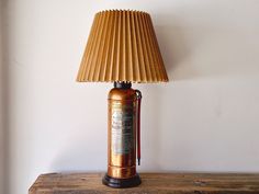 a lamp that is on top of a wooden table