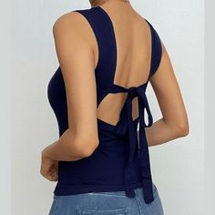 Please refer to our sizing chart for a guideline when choosing a size. 5 business days order processing time. 90% polyester 10% spandex. Fitted Seamless Backless Tops, Casual Seamless Backless Top, Seamless Stretch Backless Tops, Trendy Seamless Backless Top, Solid Color Seamless Backless Top, Seamless Solid Color Backless Top, Black Scoop Back Top For Summer, Chic High Stretch Backless Top, Elegant Crew Neck Tank Top For Summer