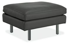 a black ottoman with metal legs on an isolated white background